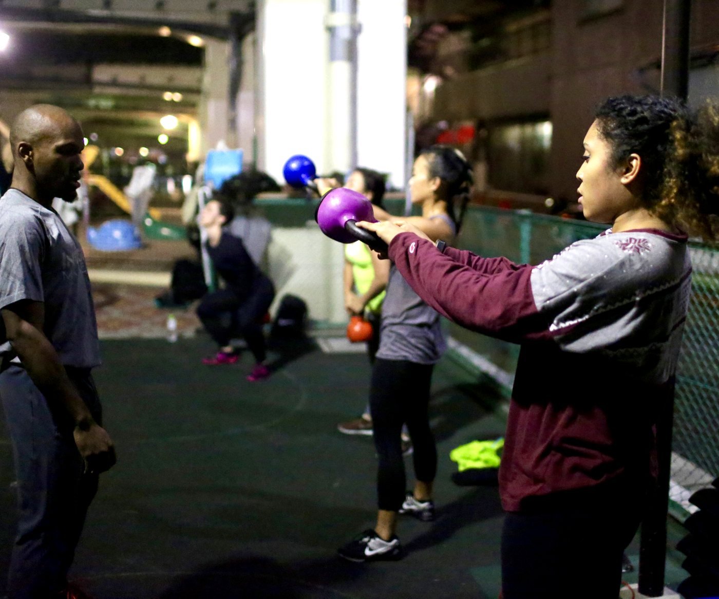 Coach Allan watching a member's kettlebell swing form